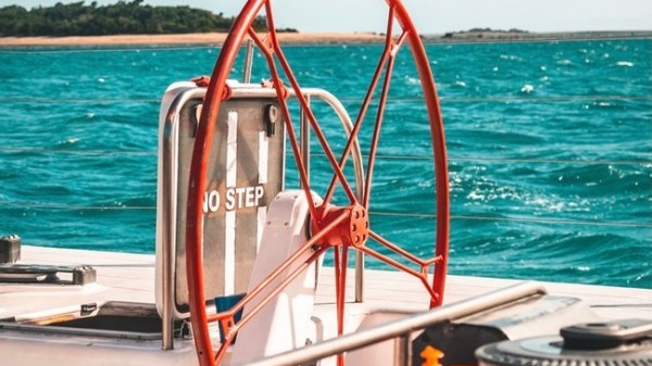 a boat sitting on top of a beach