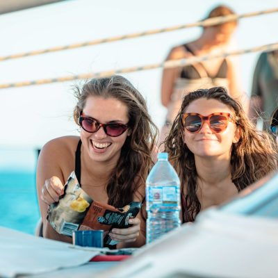 a woman in glasses looking at the camera