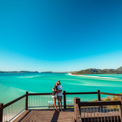 a wooden pier next to a body of water