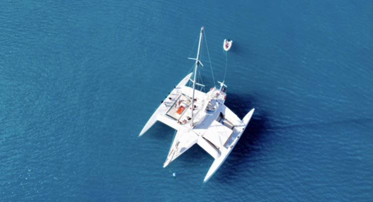 a small boat in a large body of water