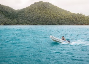 a person riding a surf board on a body of water