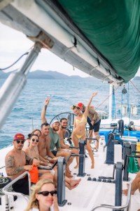a group of people on a boat in the water