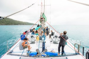 a group of people on a boat in the water