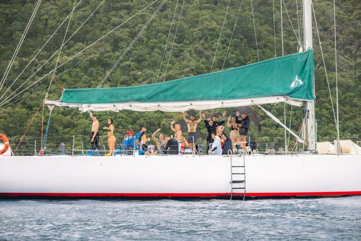 a group of people on a boat in the water