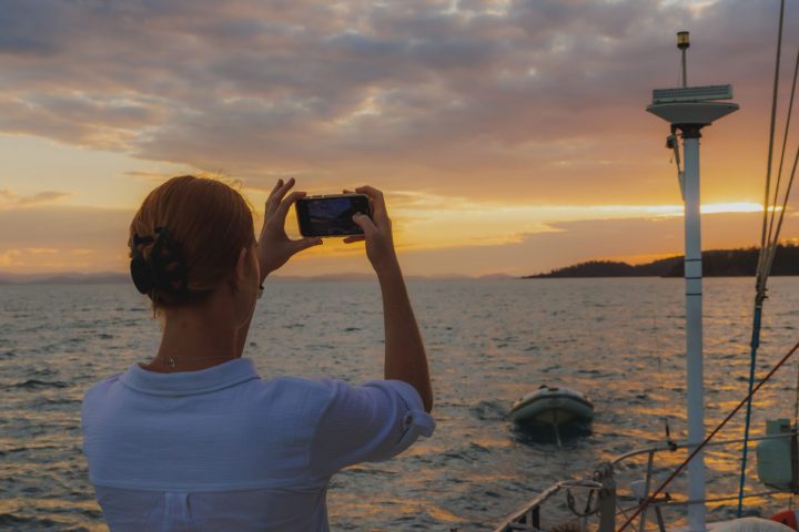 a person standing next to a body of water