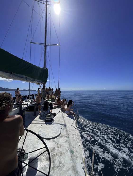 a group of people in a boat on a body of water